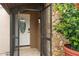 Screened entry with stone accents leads to the front door featuring decorative glass insert at 721 Mendoza Dr, Orlando, FL 32825