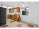 Bright kitchen features tile flooring, stainless steel appliances, wooden cabinetry and natural light at 721 Mendoza Dr, Orlando, FL 32825