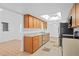 Bright kitchen with skylight, stainless appliances, and tiled floors leads to a dining area at 721 Mendoza Dr, Orlando, FL 32825