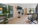 Relaxing screened patio with tile floor, ceiling fan, and view to outdoors at 721 Mendoza Dr, Orlando, FL 32825