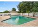 Inground pool with brick paver patio, privacy fence, and mature landscaping at 721 Mendoza Dr, Orlando, FL 32825