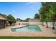 Inviting pool with brick surround, lush landscaping, and private backyard, perfect for outdoor enjoyment at 721 Mendoza Dr, Orlando, FL 32825