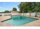 Backyard in-ground pool featuring brick pavers, vinyl privacy fence, and lush landscaping for a relaxing outdoor experience at 721 Mendoza Dr, Orlando, FL 32825