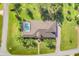 Lovely home boasts a screened-in pool, mature landscaping, and proximity to nearby streets at 7350 Spring Mountain Ln, Yalaha, FL 34797
