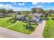 Beautiful home with lush landscaping and expansive circular driveway at 7350 Spring Mountain Ln, Yalaha, FL 34797