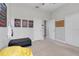 Bedroom features a ceiling fan, closet, and yellow beanbag chair at 7350 Spring Mountain Ln, Yalaha, FL 34797