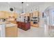 Well-appointed kitchen featuring granite countertops, an island, and maple cabinetry at 7350 Spring Mountain Ln, Yalaha, FL 34797