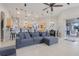 Spacious living area featuring an open floor plan, modern decor, and sliding glass doors to the patio at 7350 Spring Mountain Ln, Yalaha, FL 34797