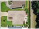 Birds eye view of a single Gathering home with manicured lawn, patio area, and concrete driveway at 8377 Se 177Th Bartram Loop, The Villages, FL 32162