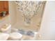 Bathroom with a toilet, tub, shower with curtain and built-in storage at 8377 Se 177Th Bartram Loop, The Villages, FL 32162