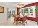 Dining room featuring a glass table set with access to the sunroom at 8377 Se 177Th Bartram Loop, The Villages, FL 32162