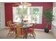 Cozy dining area with a round glass table and views of the outdoor patio at 8377 Se 177Th Bartram Loop, The Villages, FL 32162