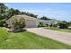 Single-story home with landscaped front yard and patterned driveway at 8377 Se 177Th Bartram Loop, The Villages, FL 32162