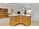 Kitchen island with breakfast bar seating offers additional space and functionality at 8377 Se 177Th Bartram Loop, The Villages, FL 32162
