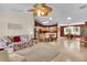 Open-concept living room with a spacious kitchen and dining area, perfect for entertaining at 8377 Se 177Th Bartram Loop, The Villages, FL 32162