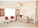Comfortable living room featuring cozy seating and a stylish display cabinet at 8377 Se 177Th Bartram Loop, The Villages, FL 32162