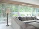 Spacious living room with plush seating and views of the outdoors, creating a cozy atmosphere at 8377 Se 177Th Bartram Loop, The Villages, FL 32162