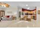 Open-concept design connects the living room to the kitchen, creating a seamless flow at 8377 Se 177Th Bartram Loop, The Villages, FL 32162