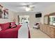 Comfortable main bedroom with access to screened lanai and neutral decor at 8377 Se 177Th Bartram Loop, The Villages, FL 32162