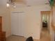 Office with view into another bedroom, ceiling fan and a closet with folding doors at 8377 Se 177Th Bartram Loop, The Villages, FL 32162