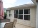Outdoor patio and adjacent screened-in porch, perfect for outdoor living and entertaining at 8377 Se 177Th Bartram Loop, The Villages, FL 32162