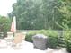 Outdoor patio with dining set and grill, ideal for entertaining and relaxation at 8377 Se 177Th Bartram Loop, The Villages, FL 32162