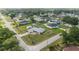 Aerial view of a single-Gathering home highlighting its well-maintained lawn, shed, pool, and a patterned driveway at 8850 Se 156Th St, Summerfield, FL 34491