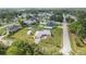 Aerial view of a single-Gathering home with an in-ground pool, shed, well-kept lawn and a decorative driveway at 8850 Se 156Th St, Summerfield, FL 34491