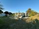 Backyard features a deck, patio with a fire pit and an open space at 8850 Se 156Th St, Summerfield, FL 34491