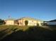 View of a house exterior and the backyard at 8850 Se 156Th St, Summerfield, FL 34491