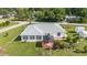 Backyard featuring a gazebo, flower garden, and well-maintained lawn at 8850 Se 156Th St, Summerfield, FL 34491