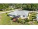 Backyard featuring a gazebo, flower garden, and well-maintained lawn at 8850 Se 156Th St, Summerfield, FL 34491