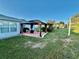 Relaxing backyard patio area with gazebo, perfect for outdoor dining and entertaining at 8850 Se 156Th St, Summerfield, FL 34491