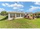 Well-maintained backyard featuring a patio with gazebo, providing ample space for outdoor activities at 8850 Se 156Th St, Summerfield, FL 34491