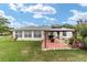 Backyard featuring patio with gazebo, ideal for relaxing and enjoying outdoor living at 8850 Se 156Th St, Summerfield, FL 34491