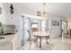 Bright breakfast nook with a bay window and charming curtains adjacent to the kitchen at 8850 Se 156Th St, Summerfield, FL 34491
