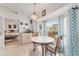 Charming breakfast nook with bright windows, a decorative chandelier, and garden views at 8850 Se 156Th St, Summerfield, FL 34491