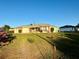 Beautiful one-story home with a cozy front porch, attached garage, and mature landscaping at 8850 Se 156Th St, Summerfield, FL 34491