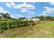 View of the home's exterior, showing the surrounding yard and fence at 8850 Se 156Th St, Summerfield, FL 34491
