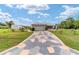 Attractive home with a two-car garage and uniquely designed driveway at 8850 Se 156Th St, Summerfield, FL 34491
