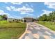Charming one-story home with a patterned driveway and attached two-car garage at 8850 Se 156Th St, Summerfield, FL 34491