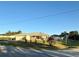 Charming one-story home featuring a well-manicured lawn, attached garage, and a cozy screened-in porch at 8850 Se 156Th St, Summerfield, FL 34491