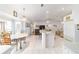 Spacious kitchen with an island, dining nook, and open floor plan connecting to the living area at 8850 Se 156Th St, Summerfield, FL 34491