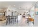 Open-concept kitchen featuring a breakfast bar, dining area, and easy access to the bedroom at 8850 Se 156Th St, Summerfield, FL 34491