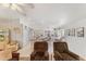 Spacious open-plan living area with tile floors, leading into dining and kitchen spaces at 8850 Se 156Th St, Summerfield, FL 34491