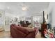 Spacious living room with open layout, hardwood floors, and sliding doors at 8850 Se 156Th St, Summerfield, FL 34491