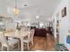 Open concept living and dining area with hardwood floors and natural light at 8850 Se 156Th St, Summerfield, FL 34491
