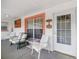 Inviting screened patio with comfortable seating and an exterior view at 8850 Se 156Th St, Summerfield, FL 34491