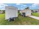 The backyard shows two storage sheds, providing ample space at 8850 Se 156Th St, Summerfield, FL 34491