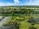 An aerial view of the lot which includes a building, a body of water, and many trees at 9269 Silver Lake Dr, Leesburg, FL 34788